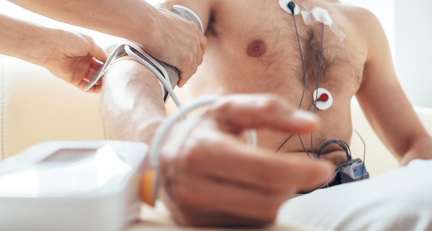 a man with a holter or event monitor attached to him